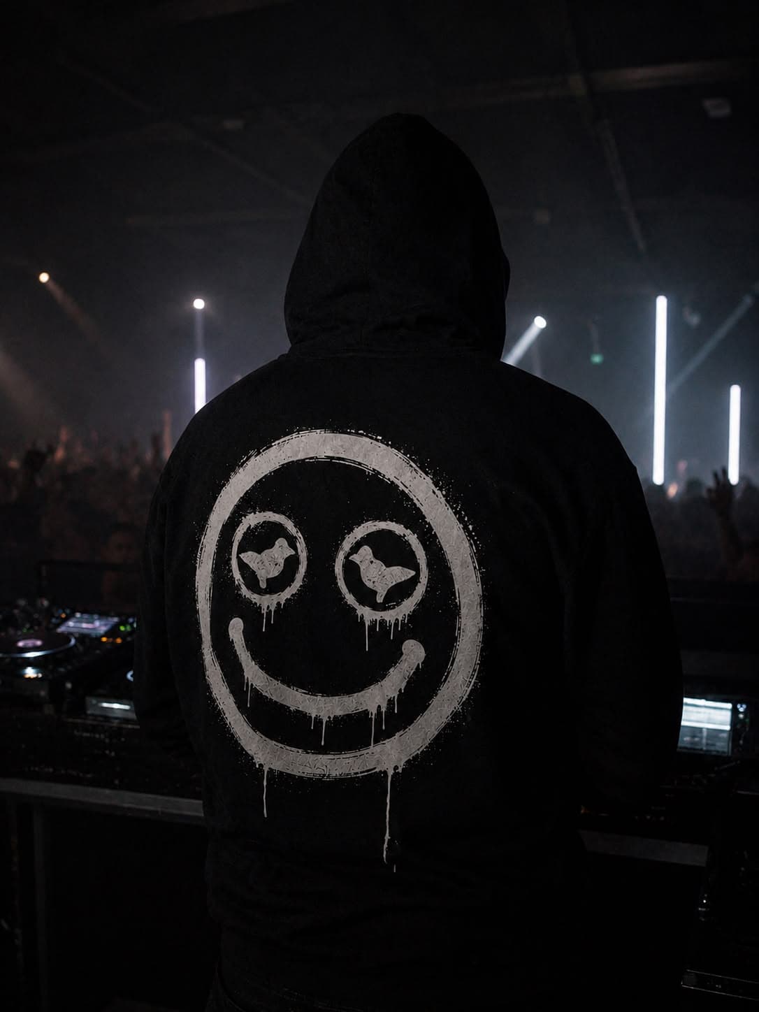 The DOVEDUP mark sprayed on the back of a hoodie at the DJ decks